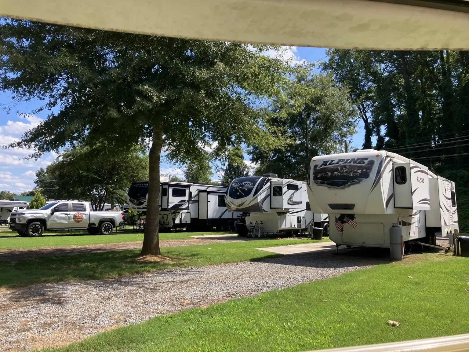 Large RV sites beneath mature shade trees